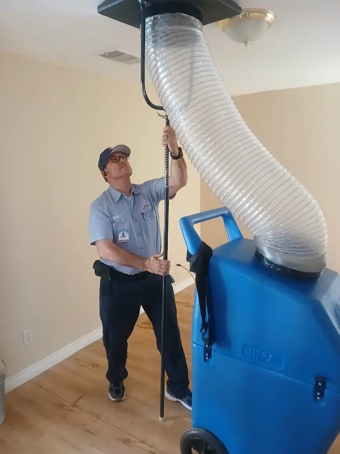 Furnace Tune-Up technician using HEPA equipment in Luzerne